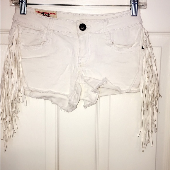 white denim fringe shorts